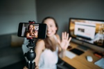 Beautiful woman vlogging at home