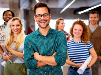 Happy business people celebrating success at company in office