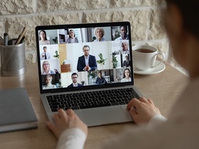 Rear close up view of diverse businesspeople talk on webcam conference conversation brainstorming on