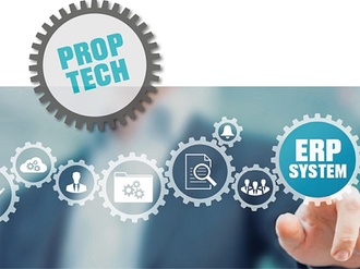 PropTech und ERP-System Schrift auf Zahnrädchen