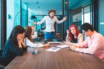 Conflict in the office. Business man arguing with his employee at meeting over latest trade report.